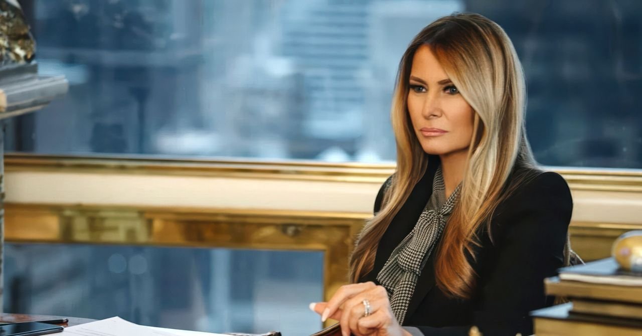 Melania Trump in sunglasses, featured in the documentary trailer, walking in a grand room.