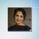 A woman meditating or in a state of calm, symbolizing stress management and balance during menopause, with subtle Ayurvedic elements.