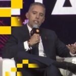 Beyond Convertibles: How Perpetual Preferreds Could Reshape MicroStrategy's $8 Billion Debt Landscape 6 Michael Saylor contemplating financial charts with Bitcoin logos in the background, symbolizing debt management strategies.