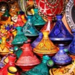 Vibrant Moroccan handicrafts including pottery, rugs, and traditional clothing, symbolizing the country's rich cultural heritage and thriving export market.