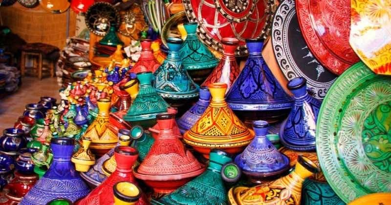 Vibrant Moroccan handicrafts including pottery, rugs, and traditional clothing, symbolizing the country's rich cultural heritage and thriving export market.
