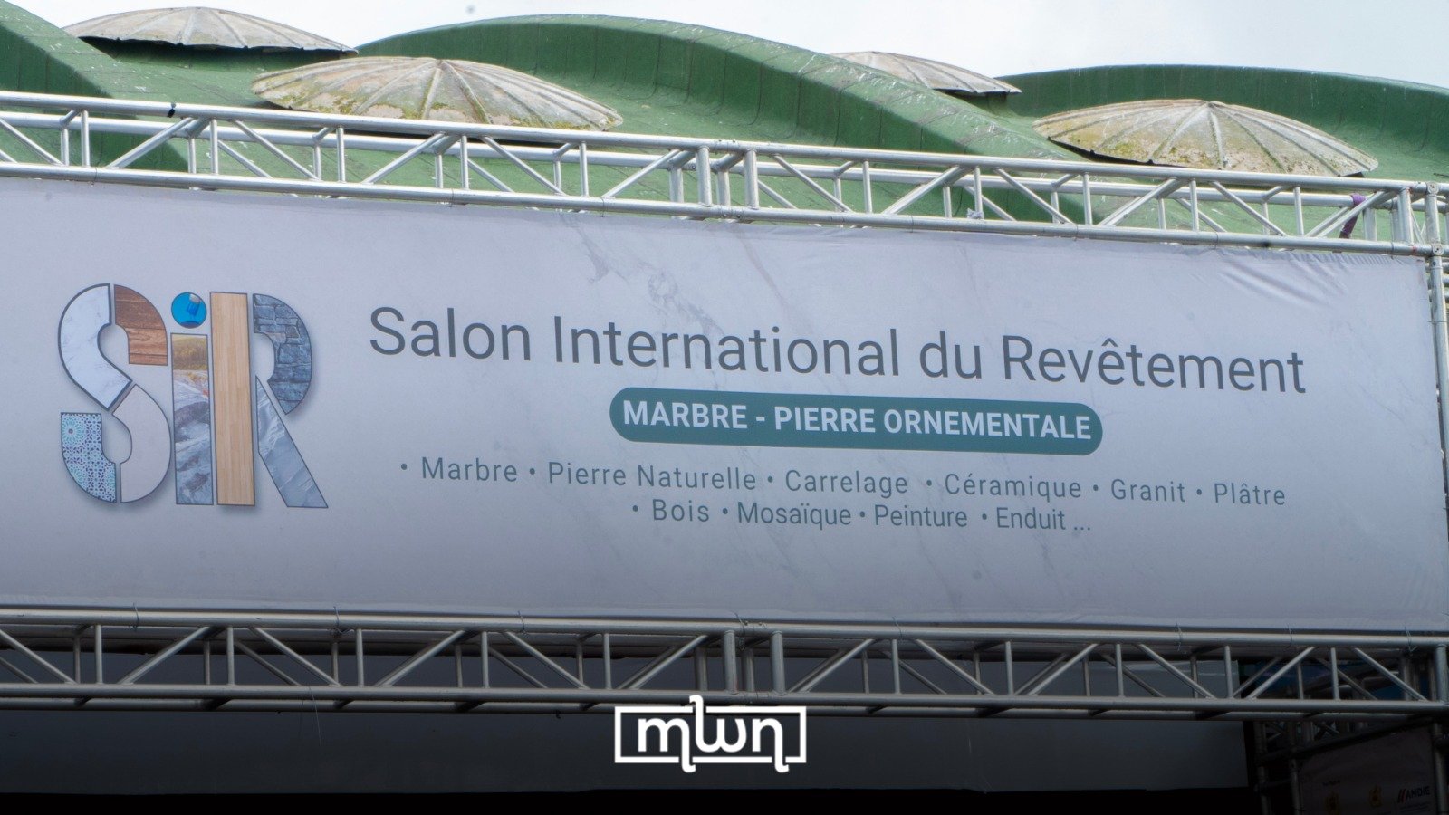 Attendees at the International Coating and Finishing Trade Fair in Casablanca, showcasing construction materials and finishes.