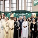 Moroccan Minister of Agriculture Ahmed El Bouari inaugurating the national pavilion at Berlin's International Green Week 2026, surrounded by delegates and agricultural displays.