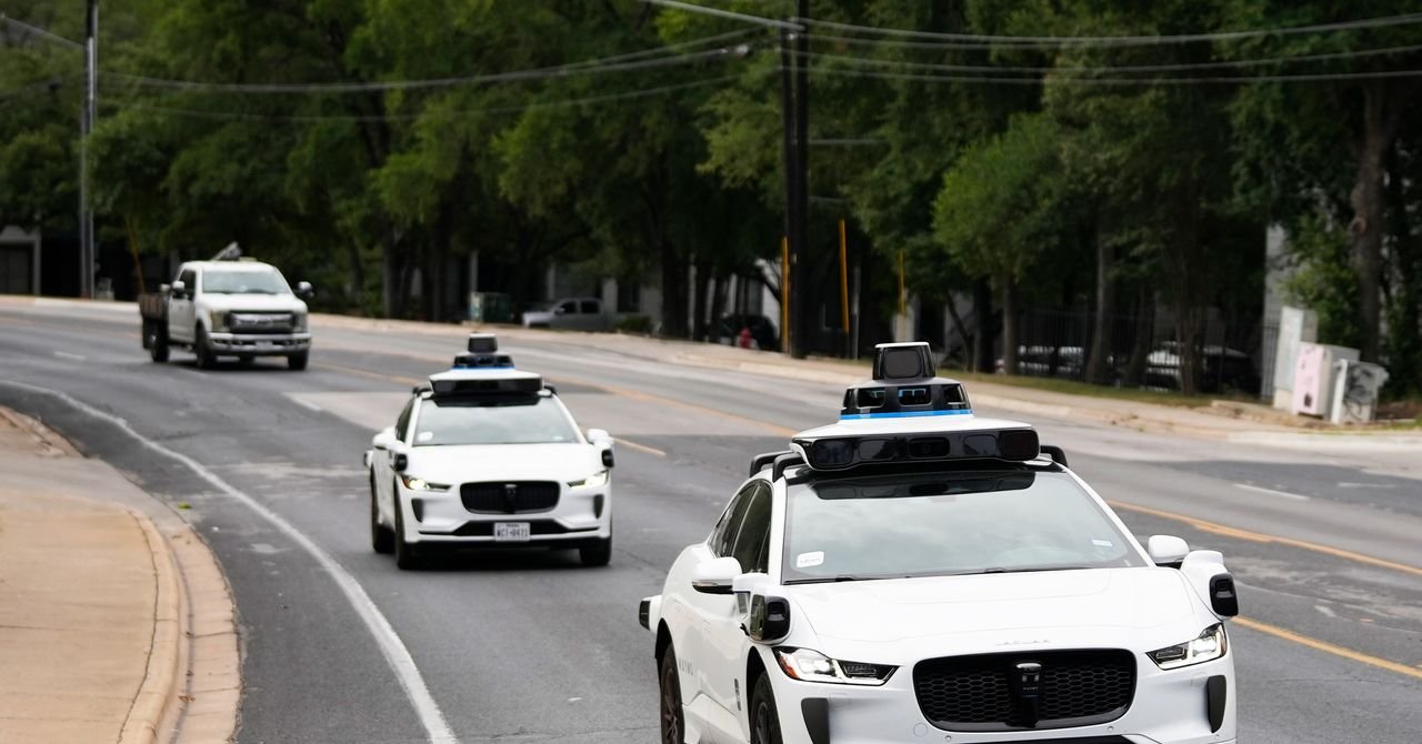 A modern self-driving car navigating a New York State road with the state capitol building in the background, symbolizing new legislation.