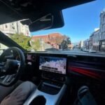 Nvidia's autonomous Mercedes-Benz CLA sedan navigating a busy street in San Francisco.