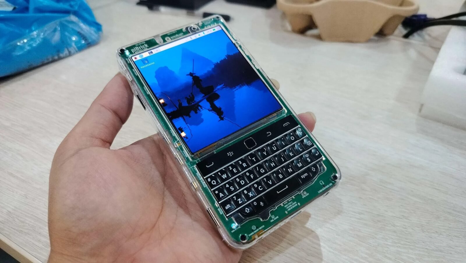 A collage of OSHWA certified open source hardware products, including an air quality monitor, a mini PC, and a high-performance desktop computer.