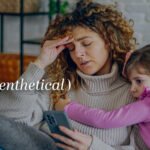 A parent looking thoughtfully while a child plays in the background, symbolizing internal reflection amidst family life.