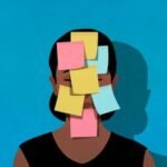 A person sitting at a desk looking tired, surrounded by office items, symbolizing post-holiday work fatigue and the need for a reset.