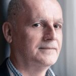 Engineers meticulously testing a secure microchip in a high-tech laboratory, symbolizing the proactive destruction necessary for quantum cybersecurity.