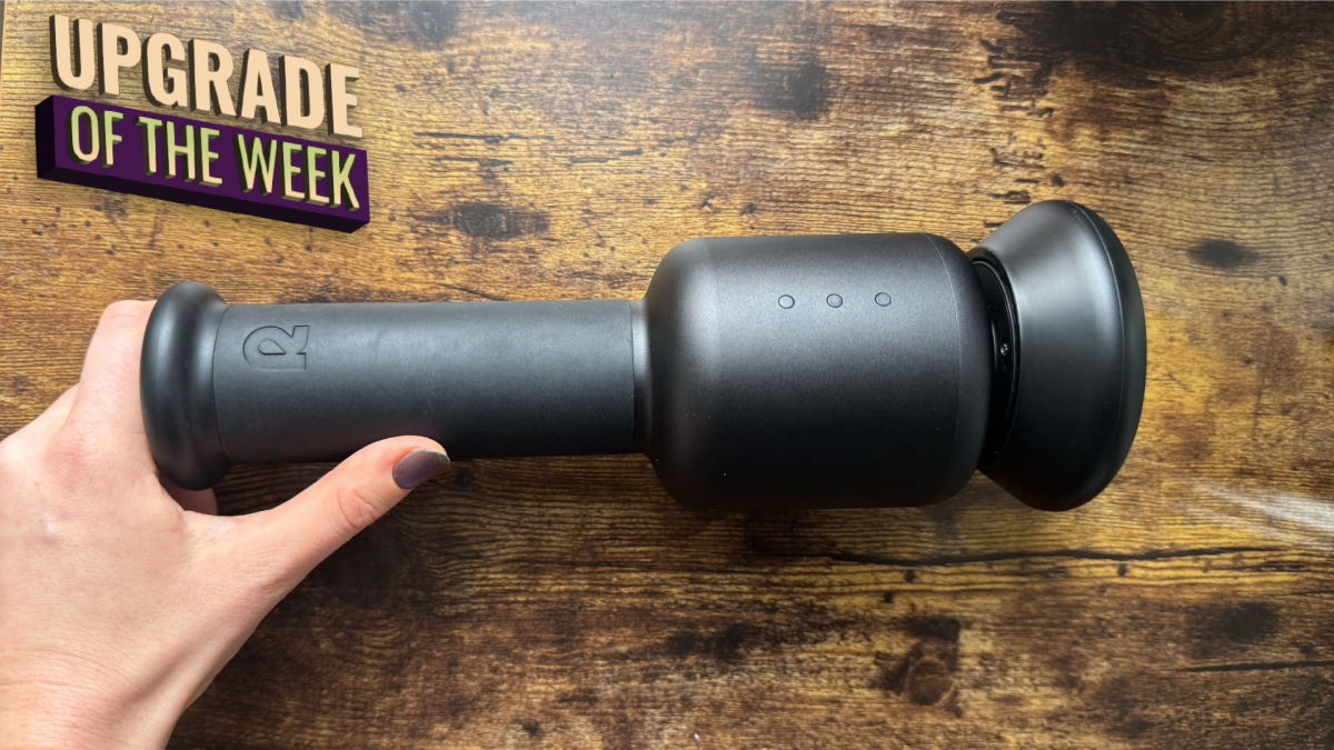 A person using the Rally Orbital Massager on their leg, demonstrating its ergonomic design and ease of use.