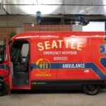 Rivian's custom electric 'vanbulance' for Grey's Anatomy, featuring 'Seattle Emergency Response Services' livery, parked on a street.