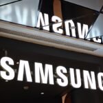 A futuristic Samsung logo against a backdrop of glowing tech products, symbolizing innovation at CES 2026.