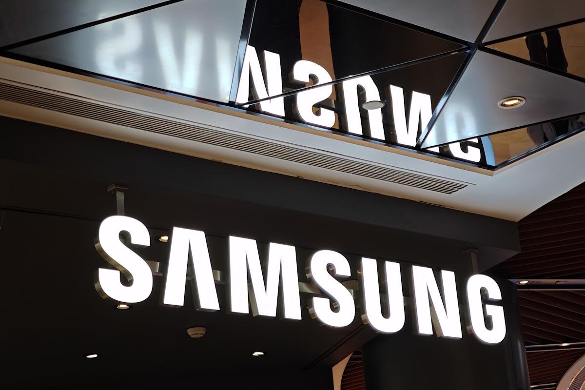 A futuristic Samsung logo against a backdrop of glowing tech products, symbolizing innovation at CES 2026.
