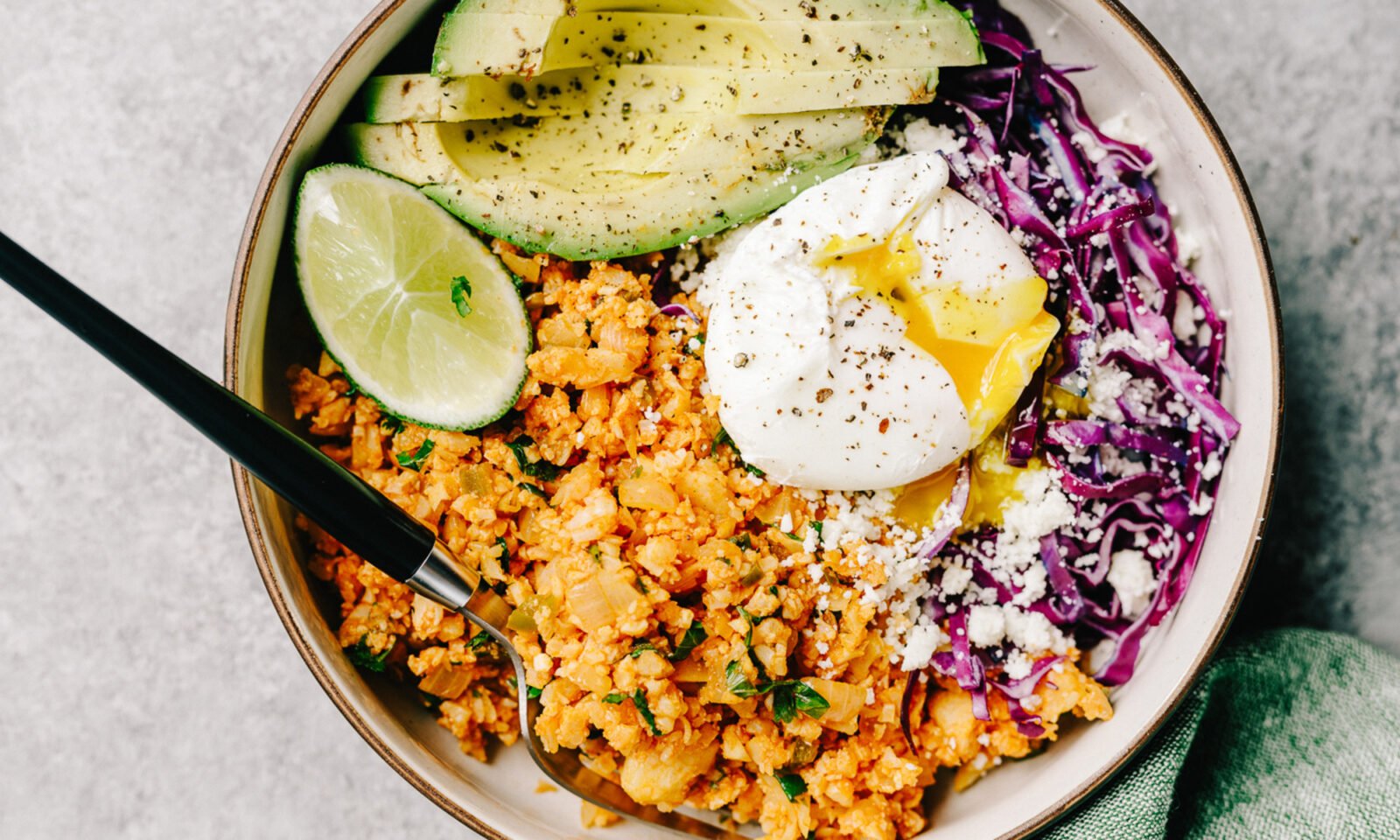 A vibrant flat lay of avocados, potatoes, chicken breast, Greek yogurt, and beans, representing satiating foods.