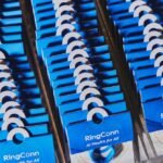 An Ultrahuman smart ring on a finger, alongside a portrait of Ultrahuman Chief Business Officer Bhuvan Srinivasan.