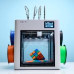 The Snapmaker U1 3D printer showcasing its four tool heads and sleek design.