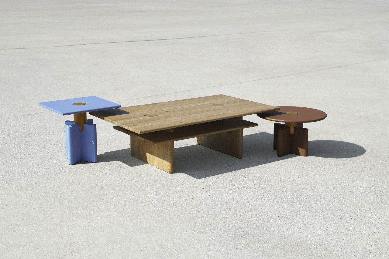 A collection of SNAPP Solis tables, showcasing geometric forms in warm wood tones.