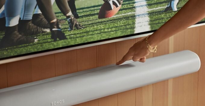 A collection of Sonos audio devices including the Era 100, Era 300 speakers, and Beam and Arc soundbars, showcasing sleek home audio setups.