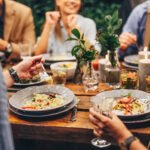 Elderly Spanish centenarian woman smiling in a garden, symbolizing longevity and connection to nature.