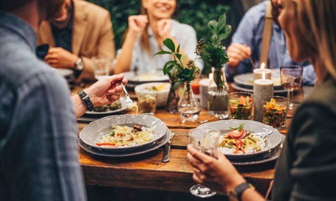 Elderly Spanish centenarian woman smiling in a garden, symbolizing longevity and connection to nature.