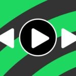 A smartphone scanning a page of a physical book, with a Spotify icon superimposed, symbolizing the Page Match feature.