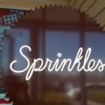 Sprinkles Cupcakes storefront with a display of colorful cupcakes