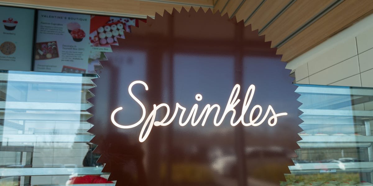 Sprinkles Cupcakes storefront with a display of colorful cupcakes