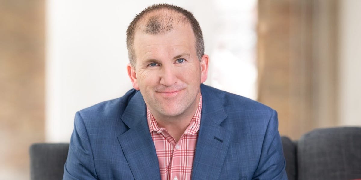 Target's incoming CEO speaking to employees with a backdrop of the Minneapolis skyline, symbolizing corporate leadership amidst urban challenges.