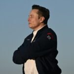 Elon Musk at an investment forum, representing Tesla's strategic direction amidst financial shifts.