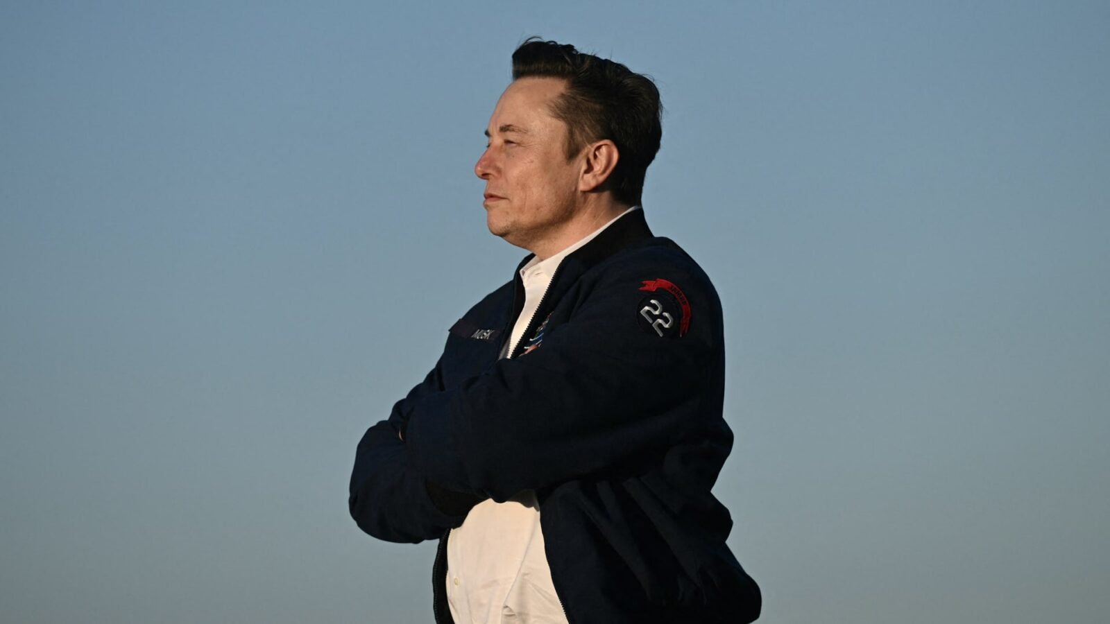 Elon Musk at an investment forum, representing Tesla's strategic direction amidst financial shifts.