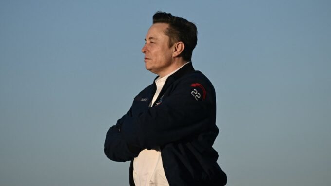 Elon Musk at an investment forum, representing Tesla's strategic direction amidst financial shifts.