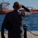 Former President Donald Trump delivering a speech, symbolizing his strong stance on international relations and policy.