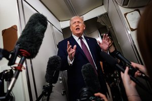President Donald Trump speaking to reporters aboard Air Force One, discussing Venezuela and ExxonMobil.