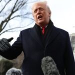Trump's Greenland Gambit: Tariffs Threaten International Relations 6 President Donald Trump gestures during a White House event, discussing national security and potential tariffs.