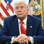 President Donald Trump looks on after signing an executive order in the Oval Office of the White House on April 9, 2025.