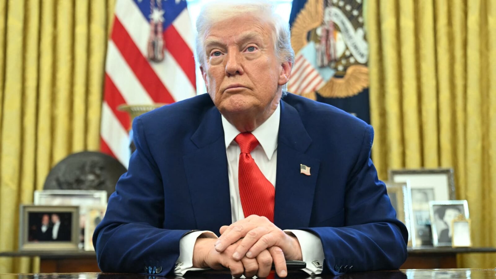 President Donald Trump looks on after signing an executive order in the Oval Office of the White House on April 9, 2025.