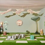 Visitors interacting with the 'Keep It Curious' exhibition by Tuleste Factory at Design Miami 2025, featuring unique furniture and art installations.