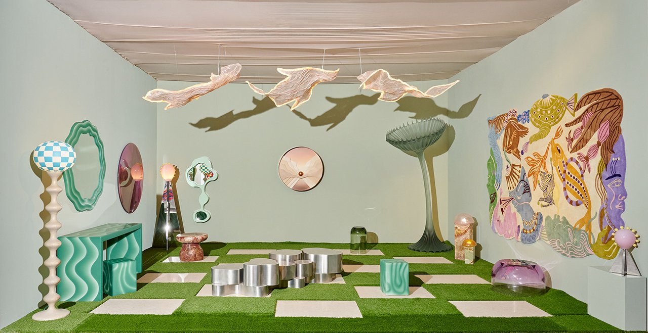 Visitors interacting with the 'Keep It Curious' exhibition by Tuleste Factory at Design Miami 2025, featuring unique furniture and art installations.