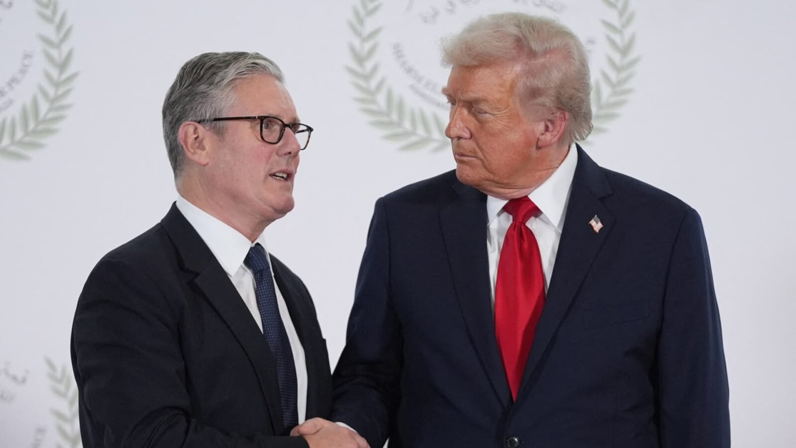 US President Donald Trump and British Prime Minister Keir Starmer shaking hands at a summit.