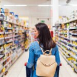 A variety of ultra-processed foods contrasted with fresh, whole foods, illustrating dietary choices and their impact on health.