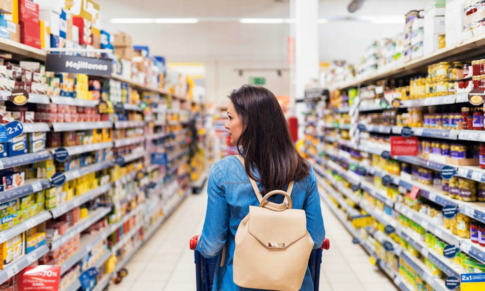 A variety of ultra-processed foods contrasted with fresh, whole foods, illustrating dietary choices and their impact on health.