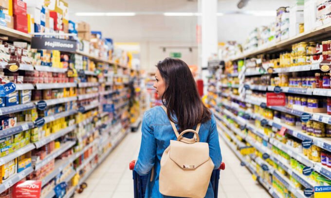 A variety of ultra-processed foods contrasted with fresh, whole foods, illustrating dietary choices and their impact on health.