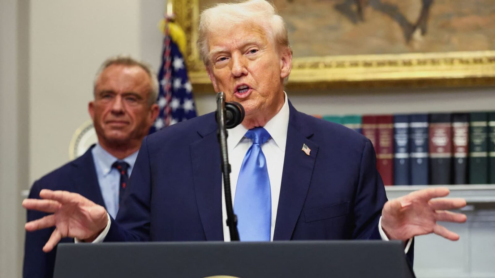 President Donald Trump discusses his new healthcare plan at the White House, with Press Secretary Karoline Leavitt also pictured at a briefing.