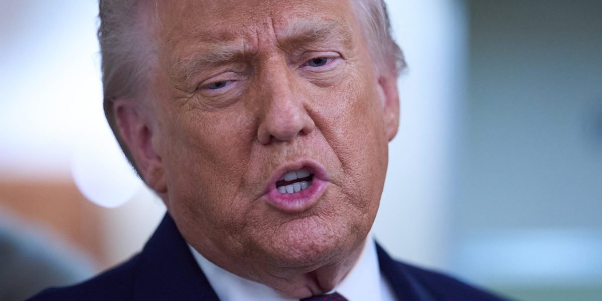 President Donald Trump and South Korean President Moon Jae-in shaking hands, with a backdrop of flags, symbolizing complex diplomatic and trade relations.