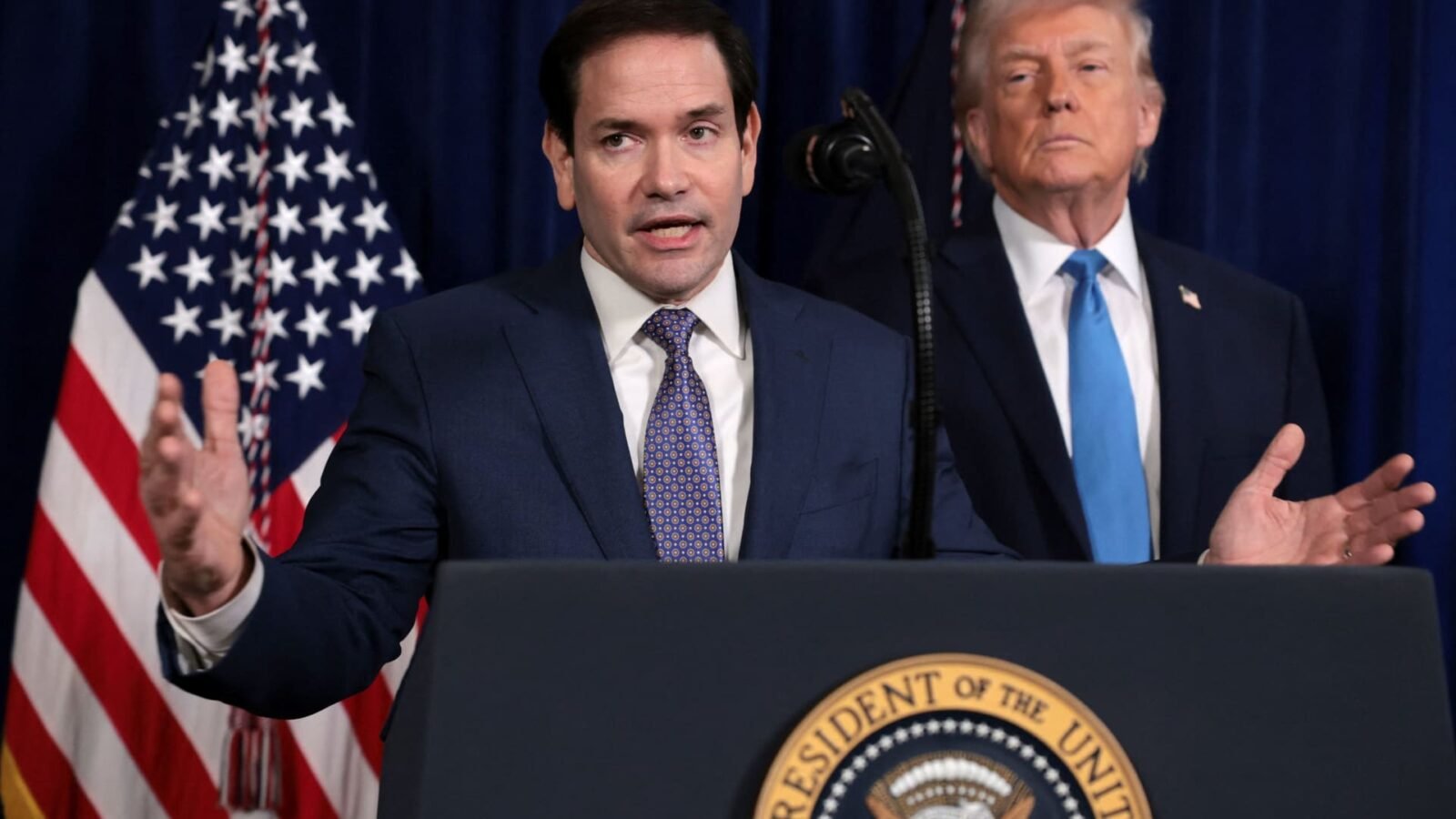 Rubio Clarifies U.S. Strategy for Post-Maduro Venezuela: Leverage Over Direct Rule 3 U.S. Secretary of State Marco Rubio speaks with President Donald Trump behind him after a U.S. strike on Venezuela.