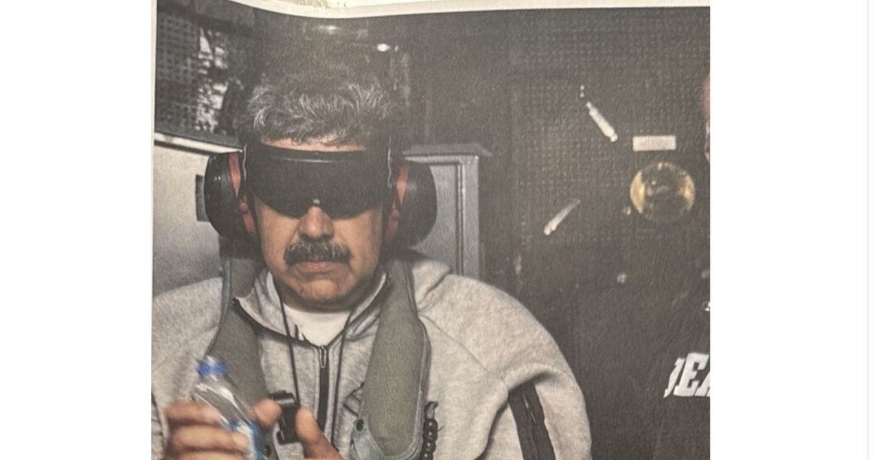 A firefighter walks past a burning military vehicle at La Carlota Air Base in Caracas after a US forces attack.