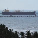 Oil tanker docked at El Palito refinery in Venezuela, symbolizing the nation's vast oil reserves.