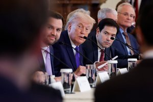 U.S. President Donald Trump (center) during a meeting with oil and gas executives in the East Room of the White House on January 9, 2026.