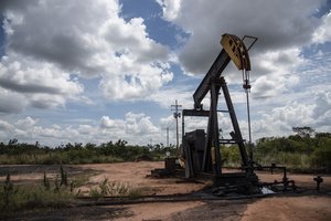 Venezuela's Oil Awakening: 3 Energy Stocks Poised for a Post-Maduro Era 3 Oil rigs or a map of Venezuela with oil symbols, representing the country's vast oil reserves and the market's reaction to recent events.