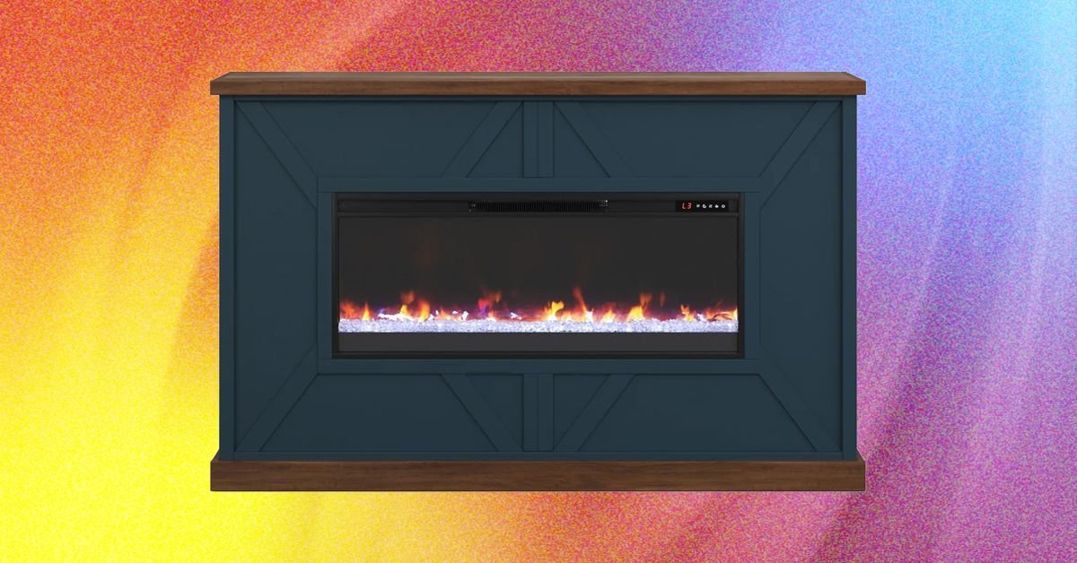 A modern ventless electric fireplace with realistic LED flames in a cozy living room setting